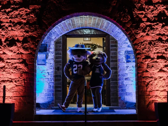 UArizona mascots Wilbur and Wilma pose outside of 