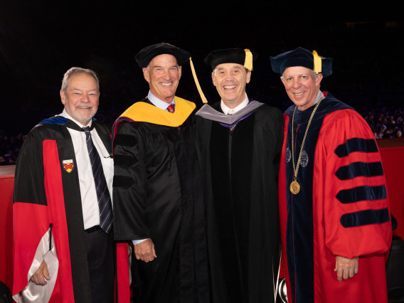 Bruce Taylor accepting his degree from University Leadership 