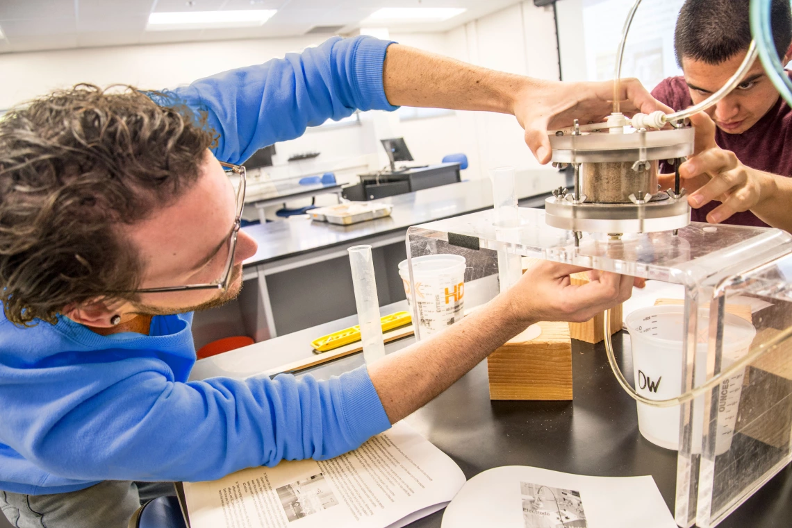 students doing research in the soil lab