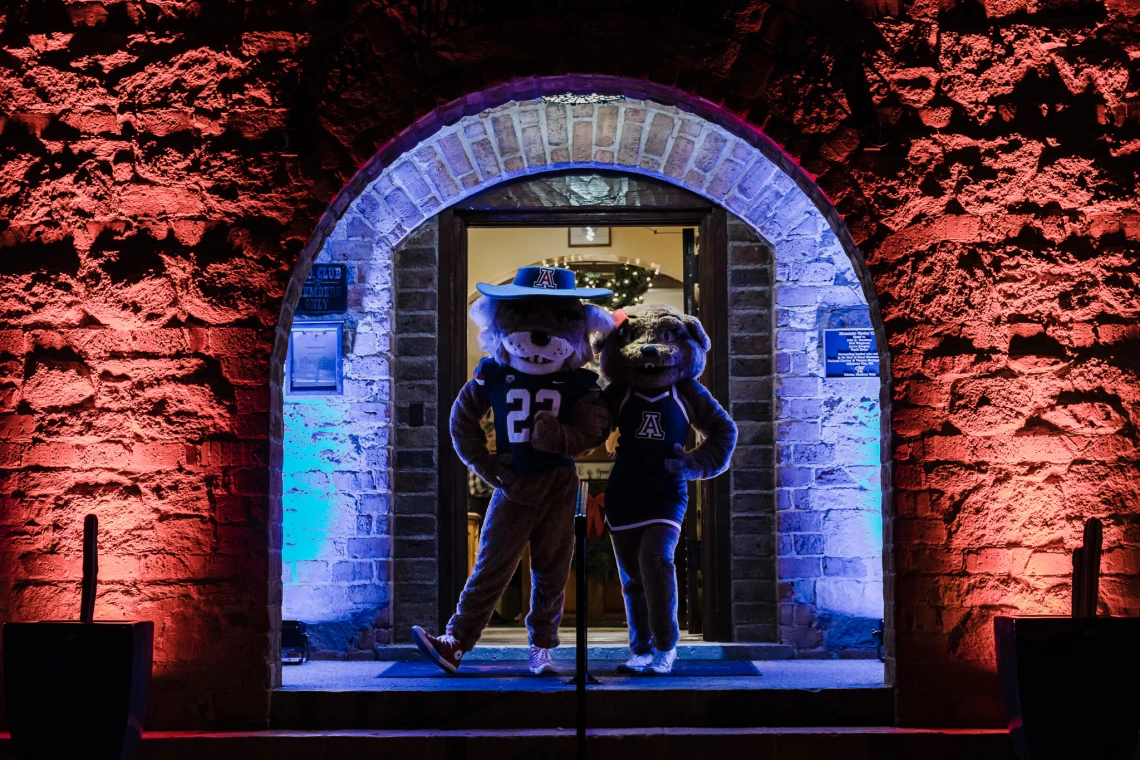 UArizona mascots Wilbur and Wilma pose outside of 