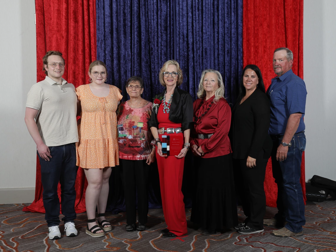 Rogers family with award.jpg