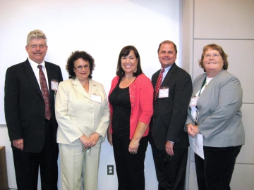 Eileen Smith poses with her team 