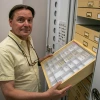 Gene Hall posing in front of the UArizona Insect Collection 